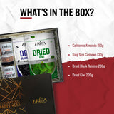 Assorted dry fruits box with almonds cashews black raisins and kiwi mix